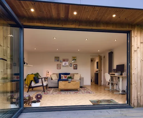 Aluminium bifold and overhang garden studio